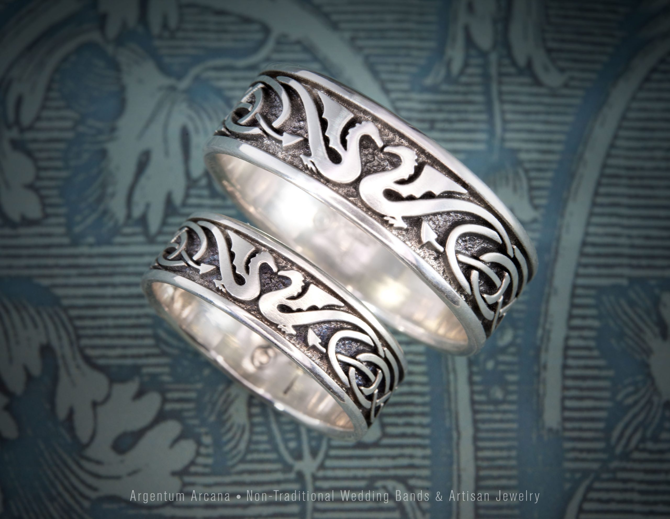 Pair of non-traditional matching wedding rings with Celtic Dragons and Celtic Knot motif