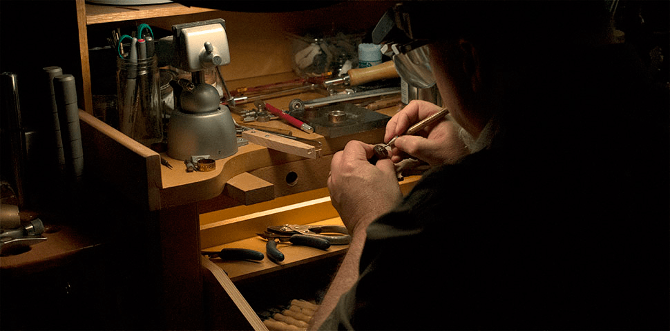 Photo of Argentum Arcana Jewelry's founder Randy Mott working at his jeweler's bench